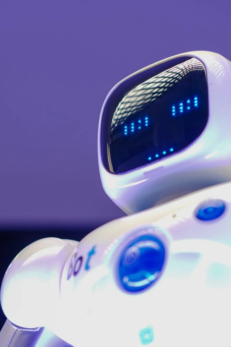 Gpt Claude Gemini Which - White robot representing artificial intelligence