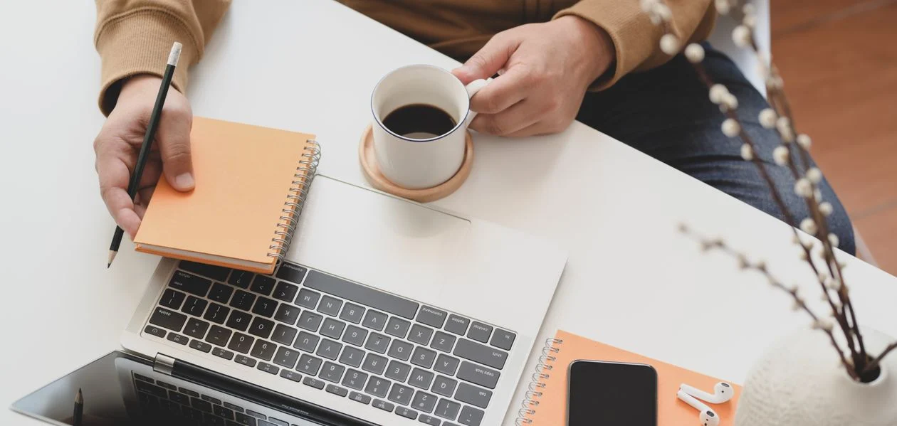 Freelancers Use AI Save - Freelancer planning work at a desk