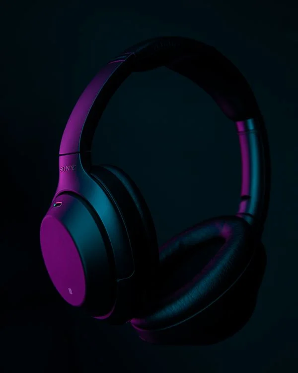 How Noise Cancelling Headphones Work - Modern black noise-cancelling over-ear headphones in a studio shot