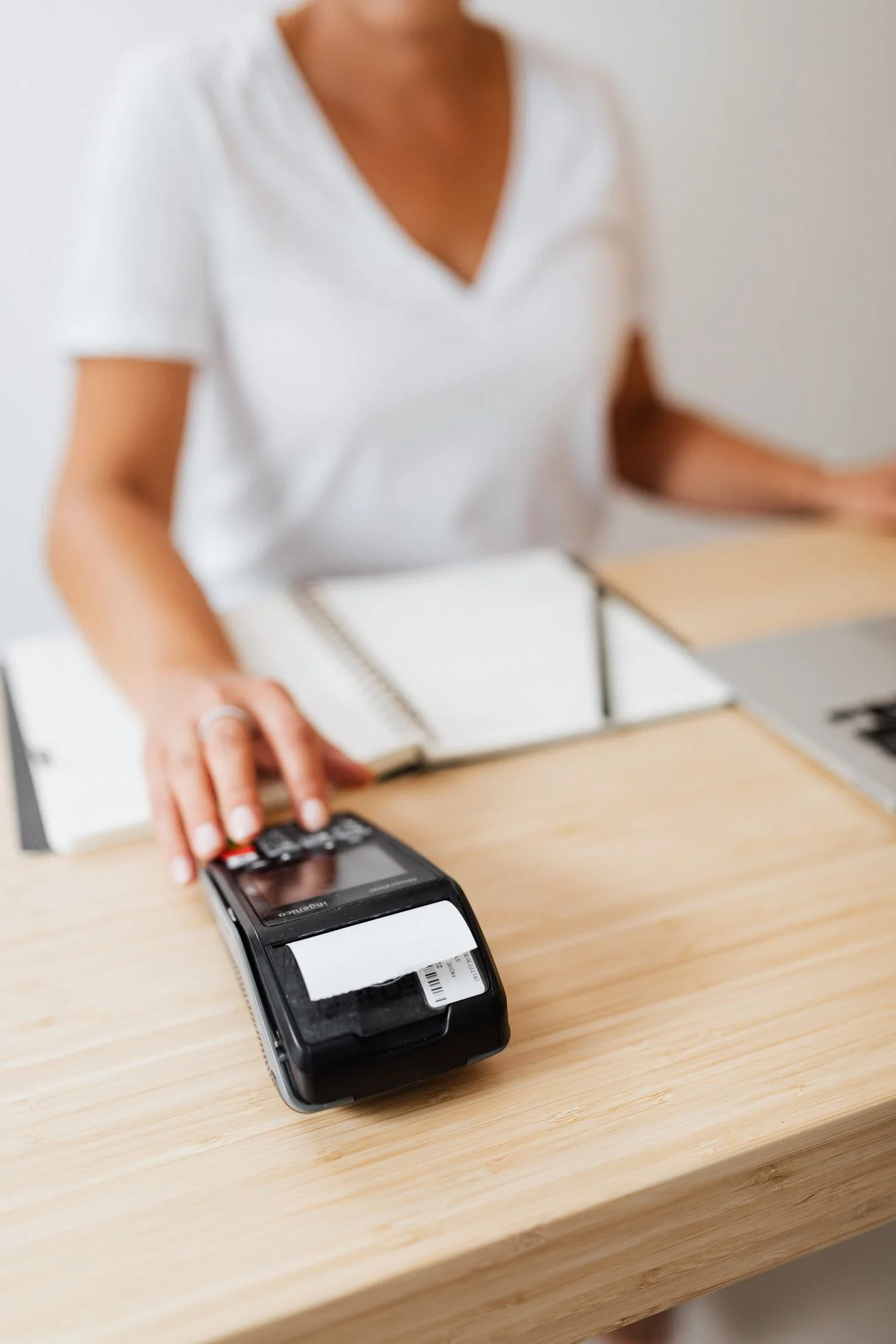 Automate Business Tasks With AI - Person processing a payment at a card terminal