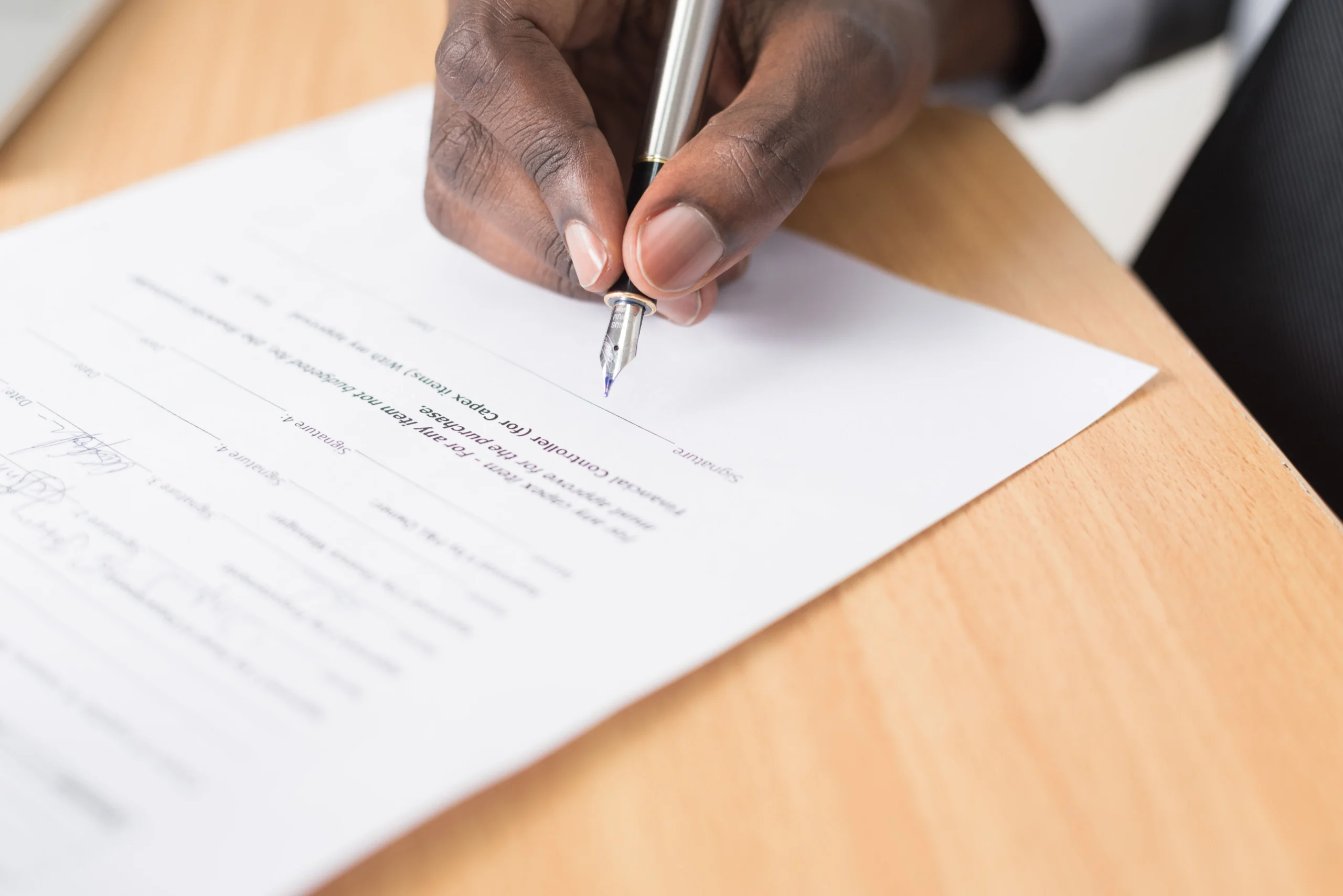 Write Freelance Proposals That - Freelancer and client signing a contract after an accepted proposal