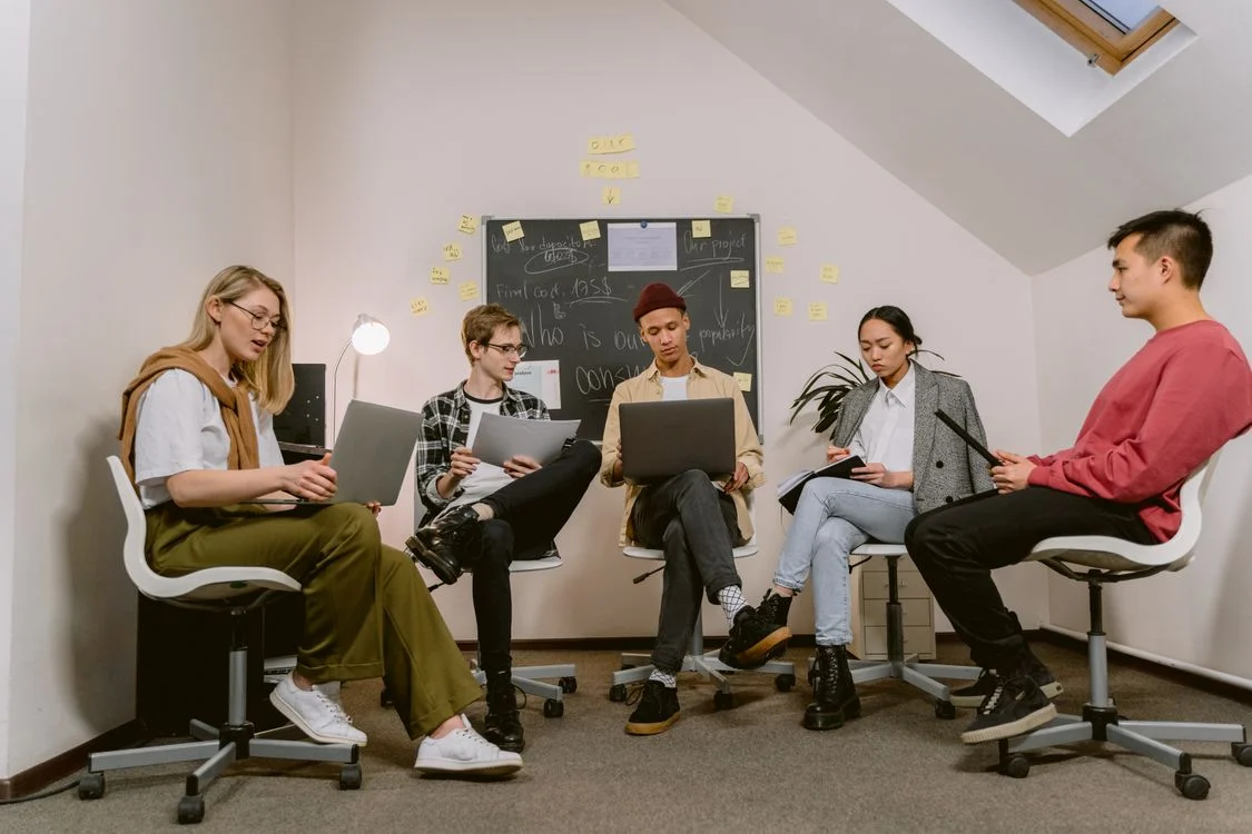What Is A CRM - Business team discussing how to engage with customers more effectively