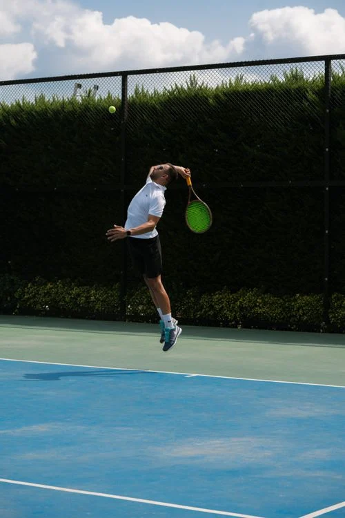 Tiebreak Tennis Format - Tennis player executing a powerful serve during a match